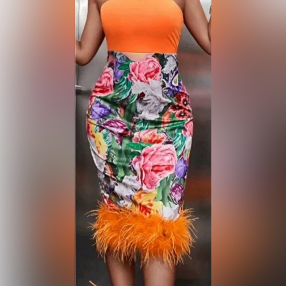 Never worn tube top dress with feathered detailing